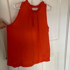LOFT sleeveless orange/coral sleeveless top. Ruffles around neck line